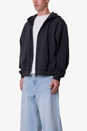 SUDADERA CON CAPUCHA Y CREMALLERA TEJIDO GRUESO · NEGRO LAVADO