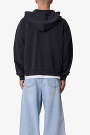 SUDADERA CON CAPUCHA Y CREMALLERA TEJIDO GRUESO · NEGRO LAVADO