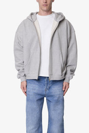 SUDADERA GRUESA GRIS JASPEADA CON CAPUCHA Y CIERRE