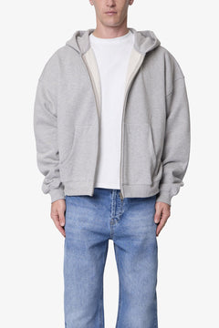 SUDADERA GRUESA GRIS JASPEADA CON CAPUCHA Y CIERRE