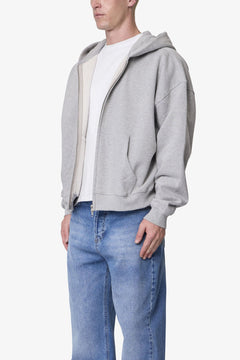 SUDADERA GRUESA GRIS JASPEADA CON CAPUCHA Y CIERRE