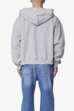 SUDADERA GRUESA GRIS JASPEADA CON CAPUCHA Y CIERRE