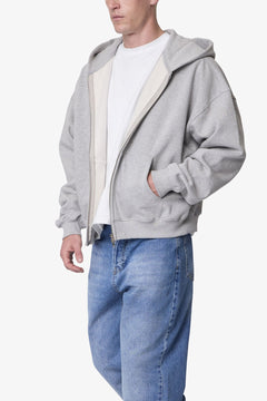 SUDADERA GRUESA GRIS JASPEADA CON CAPUCHA Y CIERRE