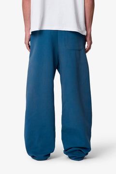 PANTALONES DE CHÁNDAL WEST DOBLE RODILLA · AZUL OSCURO